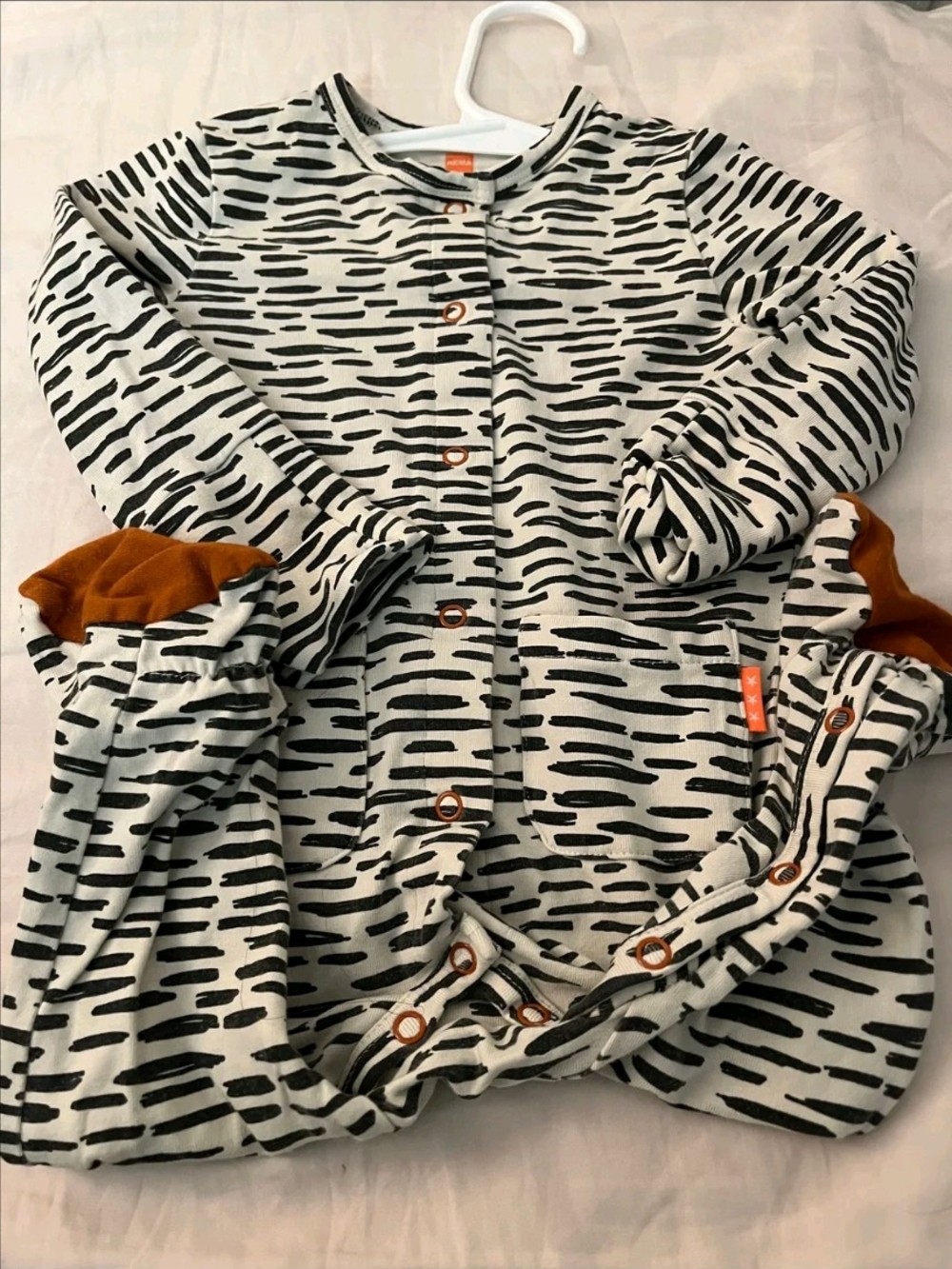 Hem One-Piece Footie in White with Black Dash Print and Rust Trim
